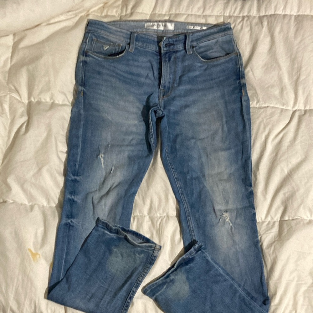 Distressed Blue Denim Jeans